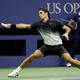Roger Federer, of Switzerland, stretches to return a shot to Frances Tiafoe, of the United States, during the U.S. Open tennis tournament, Tuesday, Aug. 29, 2017, in New York. (AP Photo/Julio Cortez)